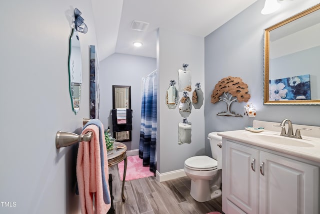 5204 Sandbridge Rd, Bailey, NC 27807 - full bath featuring toilet, vanity, wood finish floors, baseboards, and a shower with shower curtain