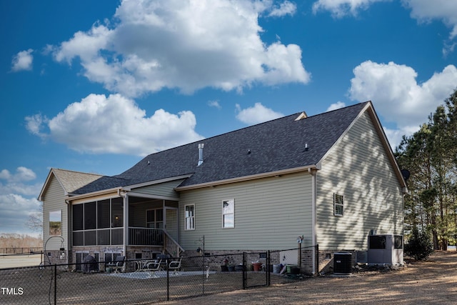 5204 Sandbridge Rd, Bailey, NC 27807 - back of property with a sunroom, central air condition unit, roof with shingles, and a gate