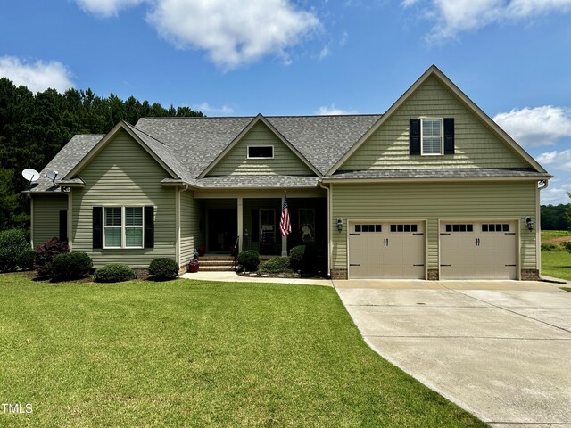 5204 Sandbridge Rd, Bailey, NC 27807 - craftsman-style house with a front lawn, driveway, a garage, roof with shingles, and a porch