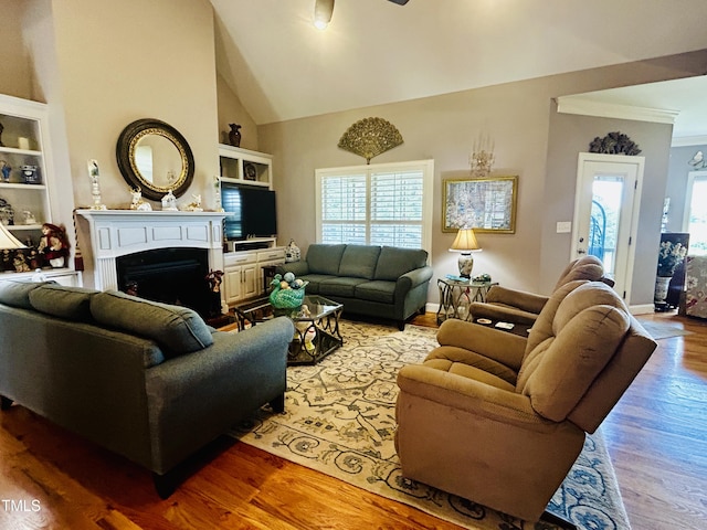 5204 Sandbridge Rd, Bailey, NC 27807 - living area with plenty of natural light, wood finished floors, ceiling fan, built in features, and crown molding