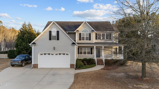 traditional-style home featuring a garage, covered porch, and concrete driveway