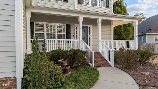 property entrance featuring a porch