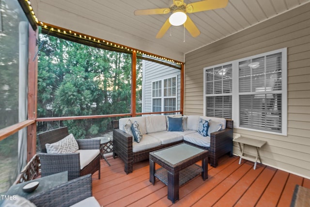 sunroom / solarium featuring ceiling fan