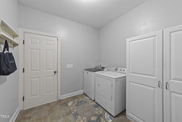 laundry room with washer and dryer, laundry area, and baseboards