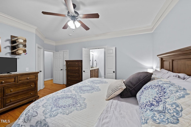 bedroom with light wood-type flooring, a ceiling fan, crown molding, and ensuite bathroom