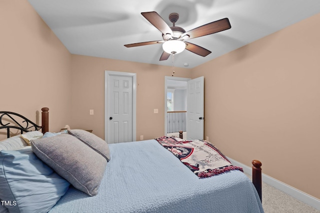 bedroom featuring a ceiling fan, carpet flooring, and baseboards