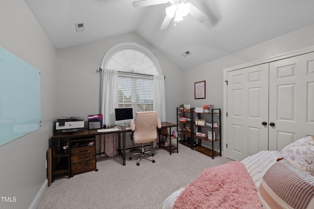 carpeted bedroom with lofted ceiling, a closet, visible vents, and ceiling fan