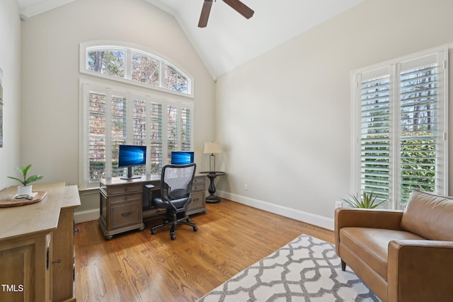 home office featuring light wood-style flooring, high vaulted ceiling, baseboards, and ceiling fan