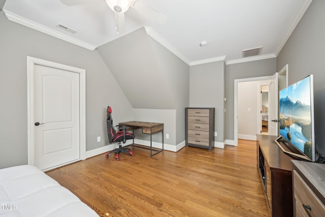 bedroom featuring light wood-style flooring, baseboards, visible vents, and ornamental molding