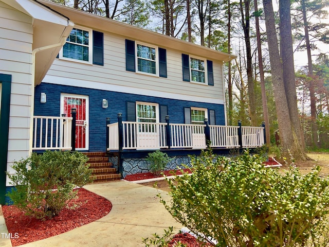 view of front of property with a porch and brick siding