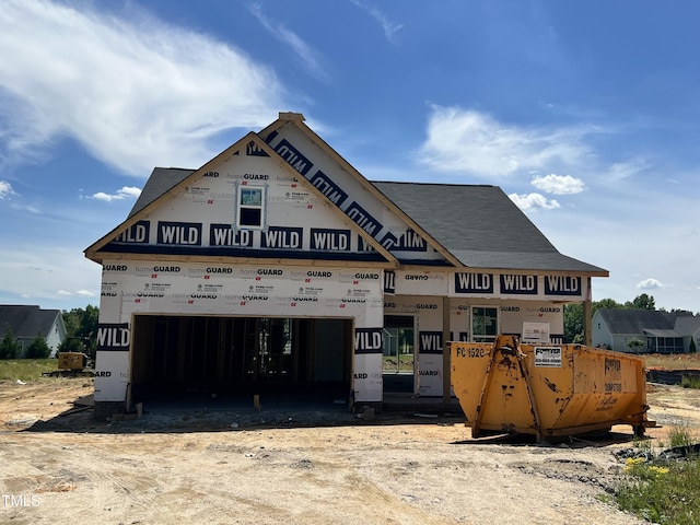 property in mid-construction with an attached garage