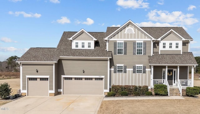 view of front of house with covered porch, concrete driveway, roof with shingles, and board and batten siding