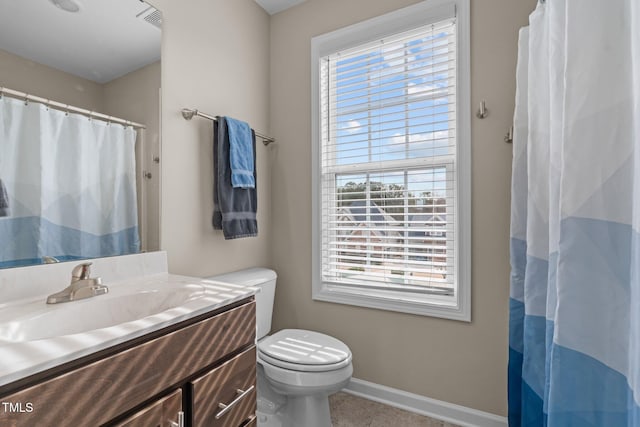 bathroom featuring visible vents, baseboards, a shower with shower curtain, toilet, and vanity