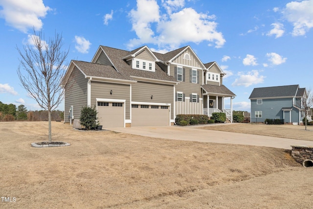 view of front of home with roof with shingles, concrete driveway, covered porch, board and batten siding, and a garage