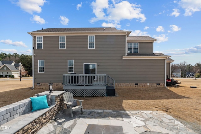 back of house featuring a deck, a patio, and crawl space