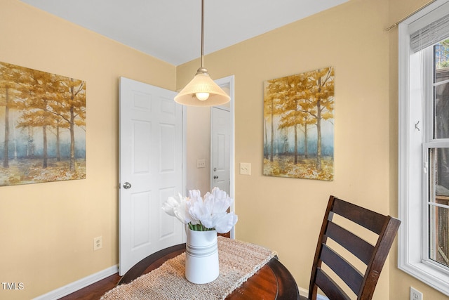 dining room featuring baseboards