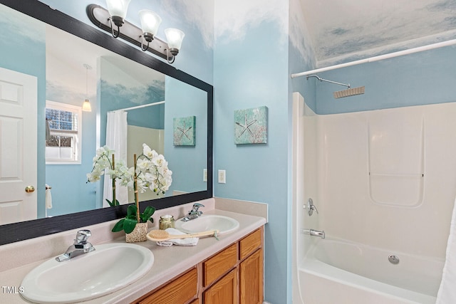 bathroom with a sink, shower / bath combo with shower curtain, and double vanity