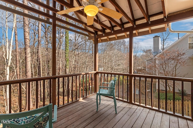 wooden deck featuring ceiling fan