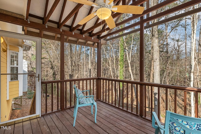 wooden deck featuring a forest view