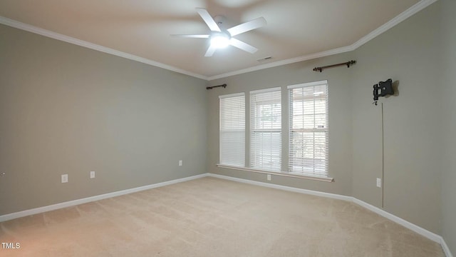 empty room featuring visible vents, crown molding, baseboards, ceiling fan, and light colored carpet