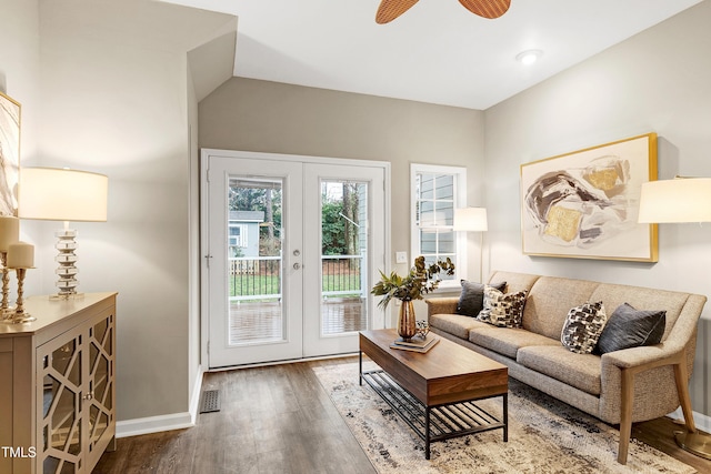 living room featuring ceiling fan, lofted ceiling, wood finished floors, baseboards, and french doors