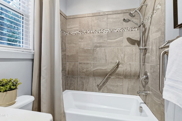 bathroom with toilet and shower / tub combo with curtain