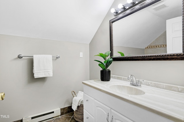 bathroom with baseboards, visible vents, vaulted ceiling, baseboard heating, and vanity