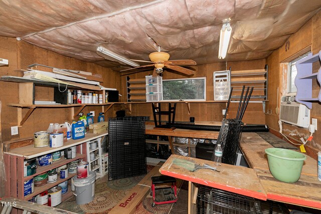 storage room with ceiling fan and cooling unit