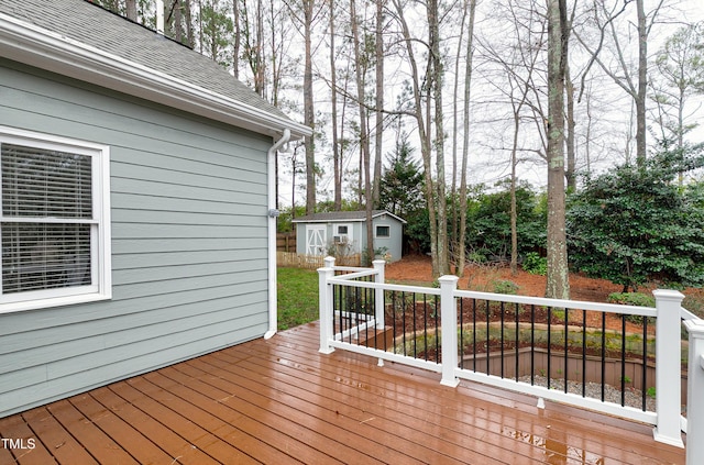 deck featuring an outbuilding and a shed