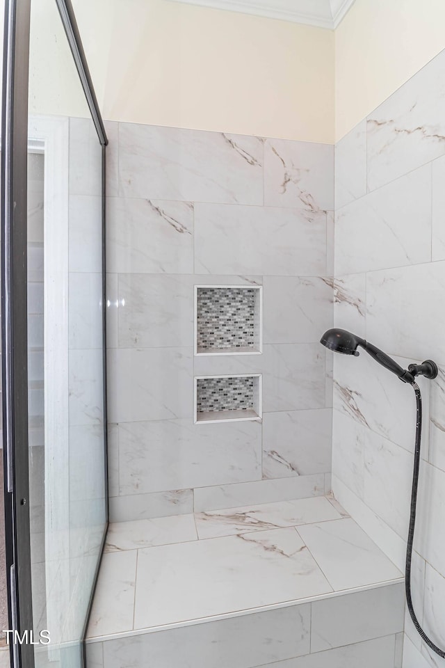 bathroom featuring tiled shower