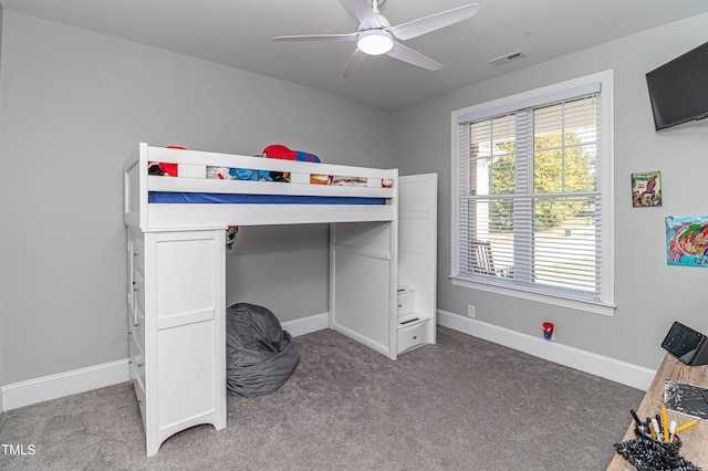 bedroom featuring carpet floors, baseboards, visible vents, and ceiling fan