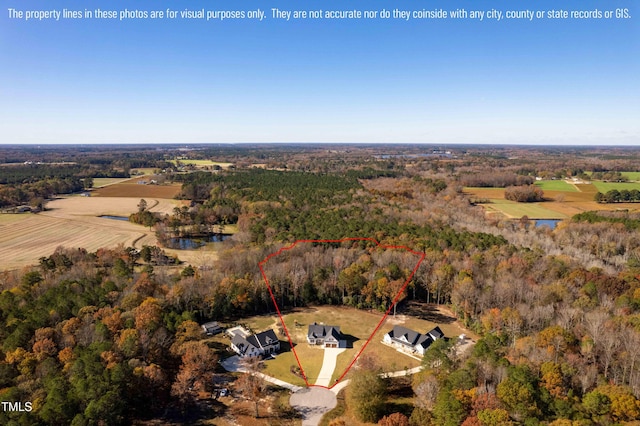 drone / aerial view with a view of trees