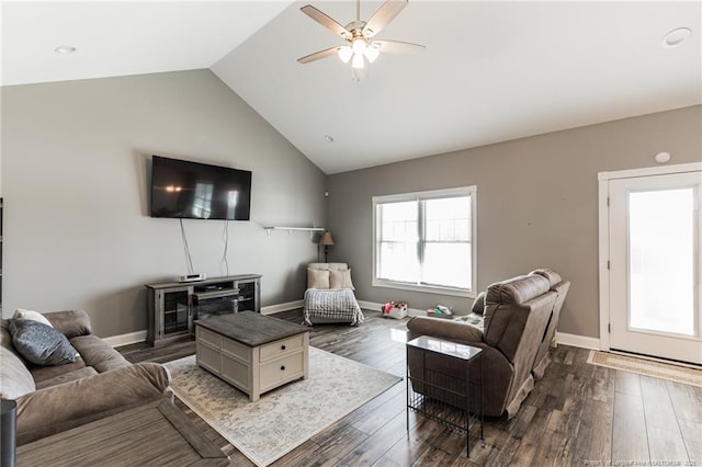 living area featuring vaulted ceiling, ceiling fan, dark wood finished floors, and baseboards