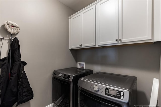 laundry area featuring cabinet space and separate washer and dryer