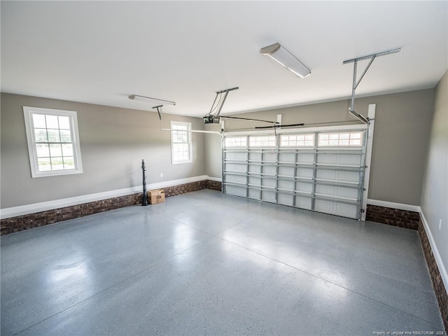 garage featuring baseboards and a garage door opener