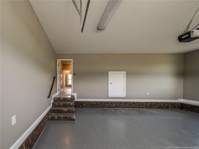 spare room featuring speckled floor and stairway