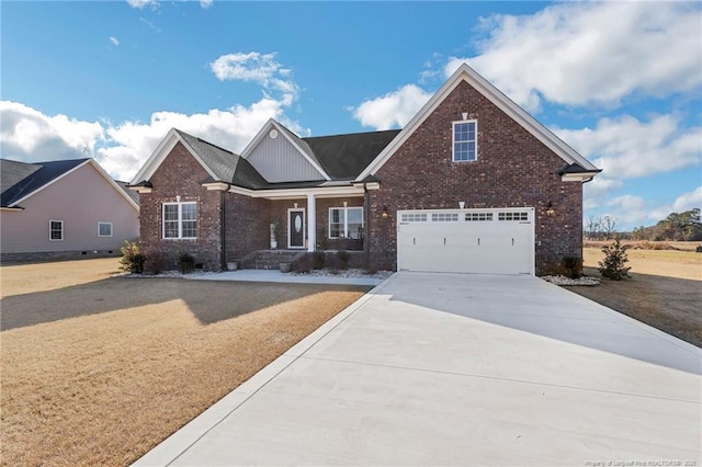 view of front of property with a front yard, brick siding, driveway, and an attached garage