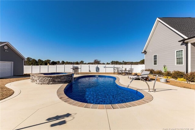 view of pool with an in ground hot tub, a fenced backyard, a fenced in pool, and a patio