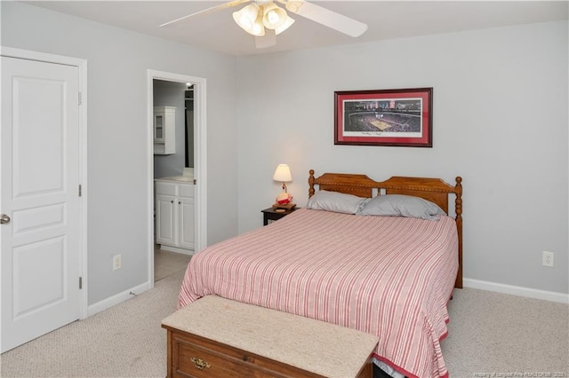 bedroom featuring baseboards, ceiling fan, connected bathroom, and light colored carpet