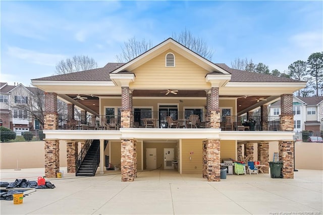 exterior space with a carport, driveway, and stairs