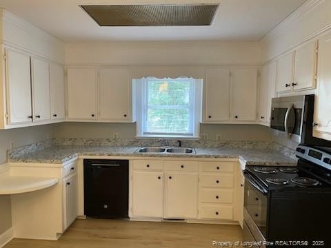 kitchen featuring light countertops, stainless steel microwave, a sink, range with electric cooktop, and dishwasher