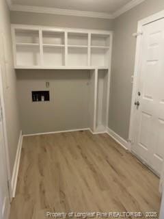 washroom featuring laundry area, baseboards, wood finished floors, hookup for a washing machine, and crown molding