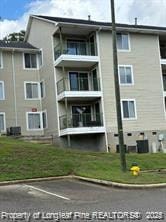 view of building exterior featuring uncovered parking