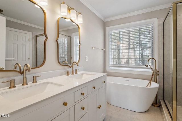 full bathroom with ornamental molding, a stall shower, a soaking tub, and a sink