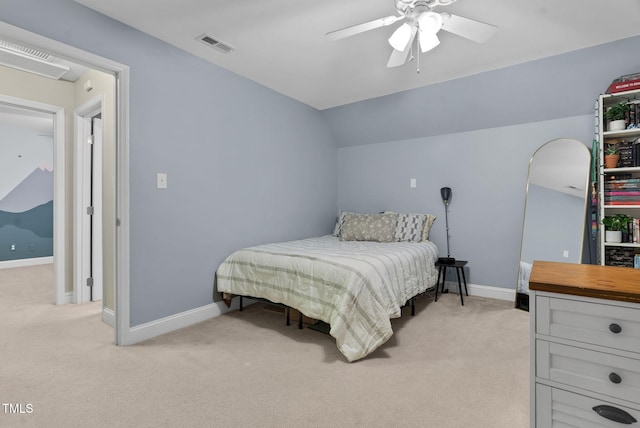 bedroom with lofted ceiling, visible vents, light carpet, ceiling fan, and baseboards