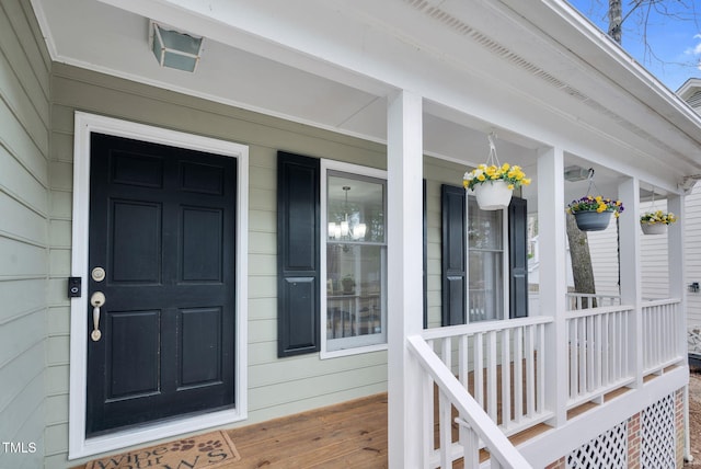 doorway to property with covered porch