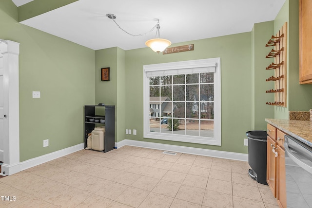 kitchen with visible vents, dishwasher, baseboards, and light tile patterned flooring