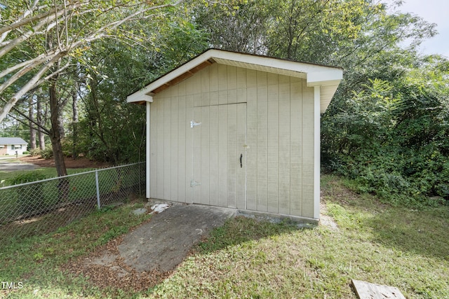 view of shed with fence