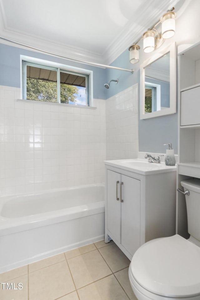 bathroom featuring tile patterned flooring, toilet, vanity, ornamental molding, and shower / washtub combination