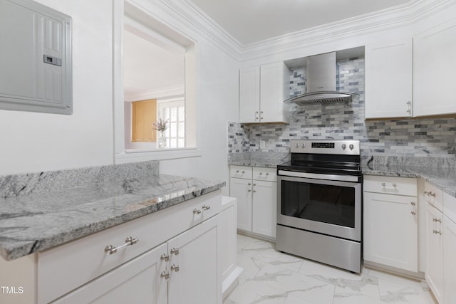 kitchen with marble finish floor, crown molding, stainless steel range with electric cooktop, electric panel, and wall chimney exhaust hood